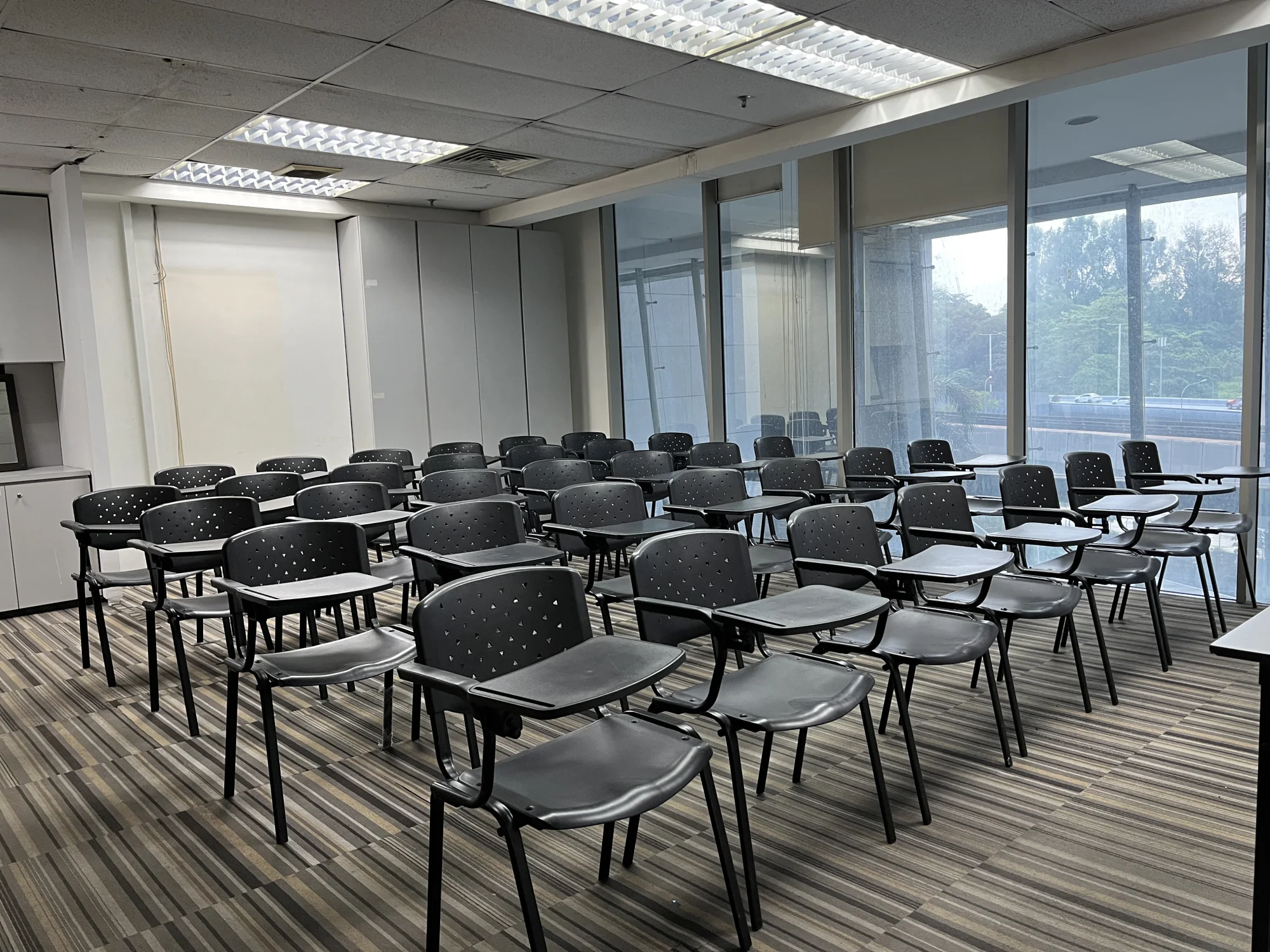 Training room arranged with classroom desks and chairs