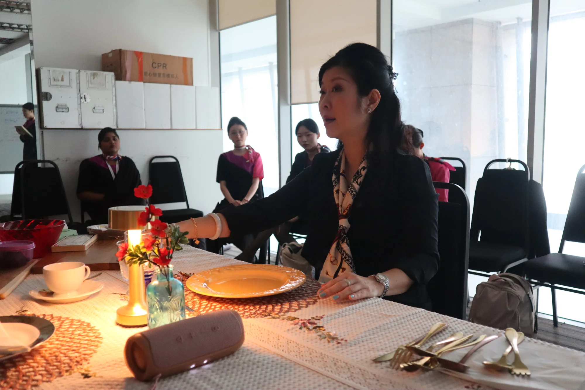 Cabin crew student practising inflight table service during training