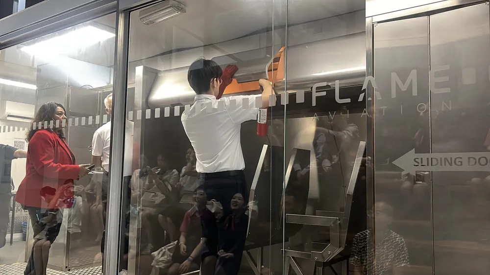 Students arriving at a building entrance seen through glass doors during an academy outing