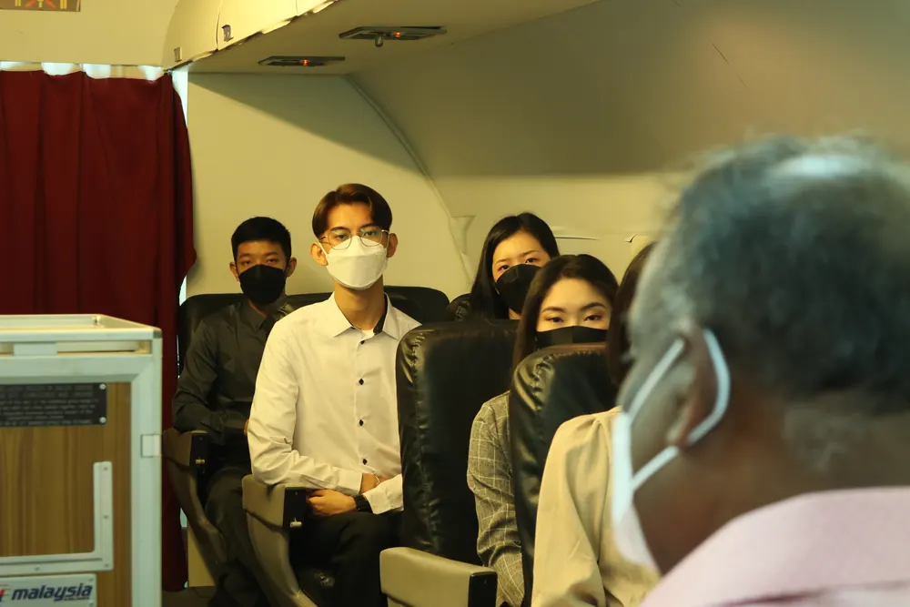 IETA trainer leading a classroom session in the mock cabin seating area