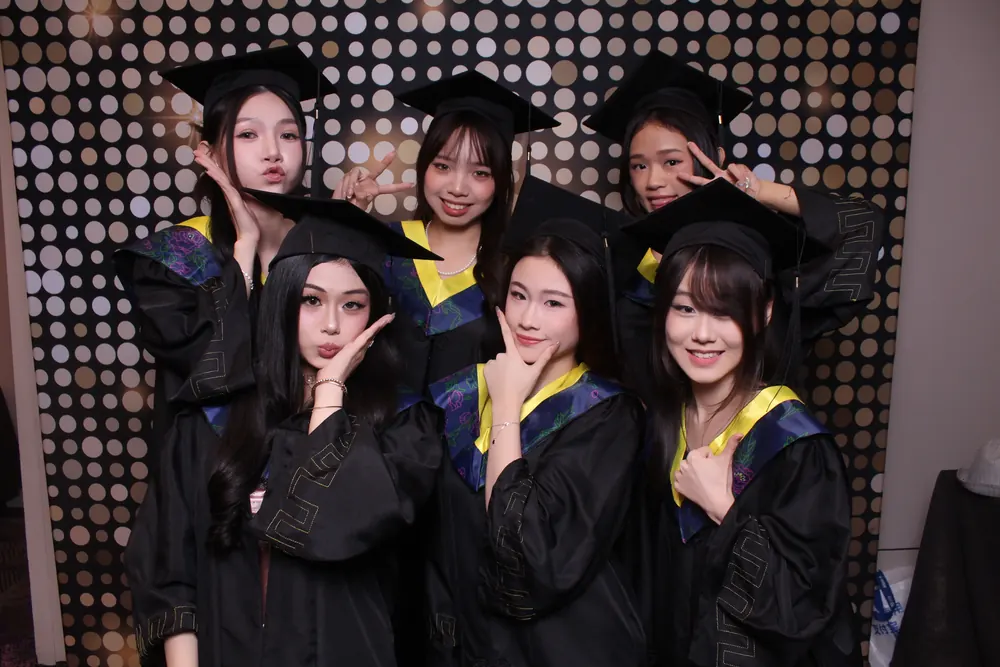 IETA students posing together at a campus photobooth